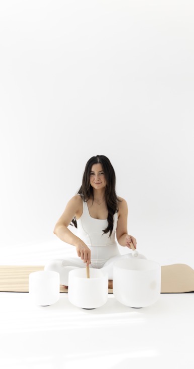 Melissa Tarpey playing crystal singing bowls